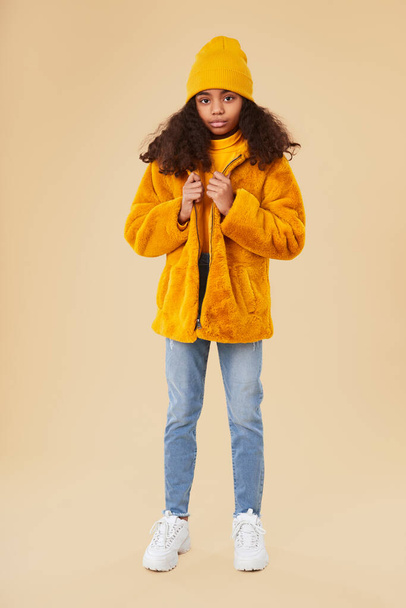 Stylish black girl in coat - 写真・画像
