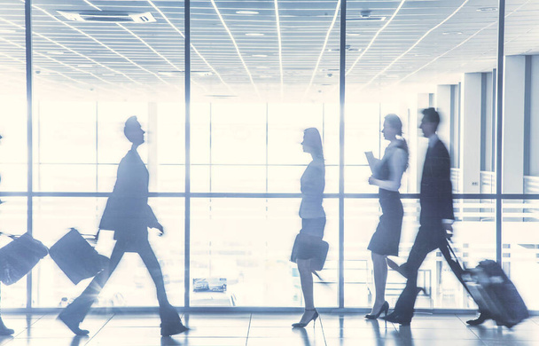 Group of  silhouettes of businesspeople going  background business centre - Foto, Imagen