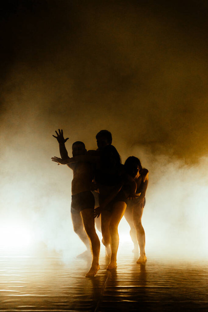 Contemporary dancing performers exercising during a dance class - Photo, Image
