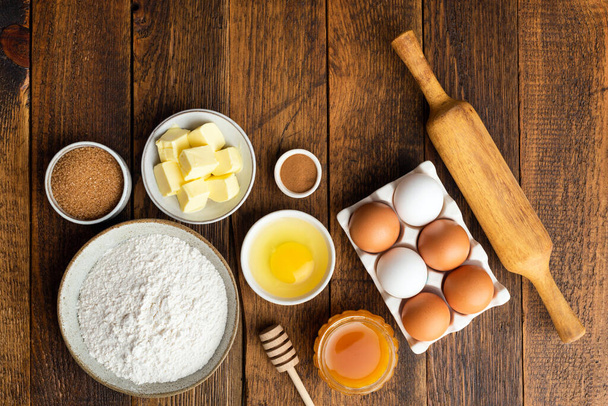 Ingredients for baking on wooden table background - Foto, imagen