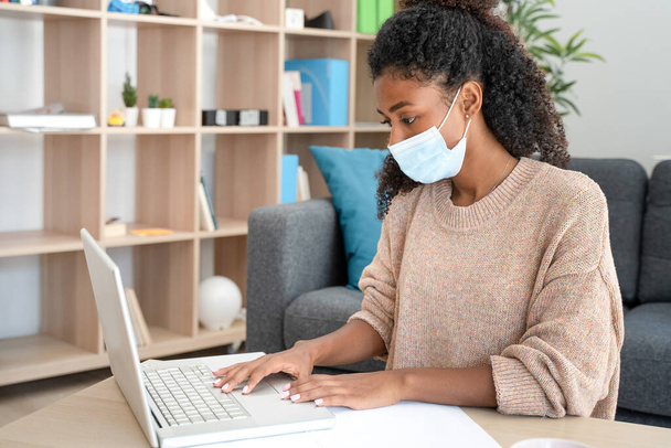 Black woman smart working from home during corona pandemic - Photo, Image