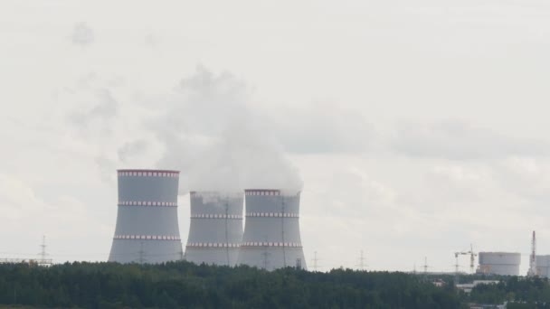 Smoking nuclear power plant industrial landscape. pollution and climate change - Footage, Video