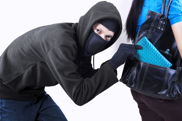 Thief stealing a wallet - Foto, Imagem