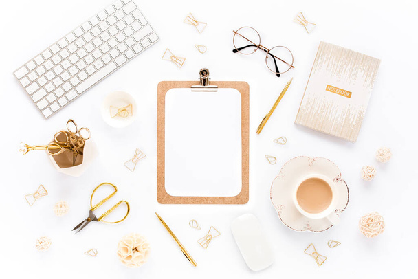 Home office workspace with computer, clipboard, notepad, laptop and golden accessories on white background. Flat lay, top view - Фото, изображение