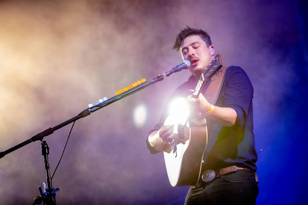 Mumford and Sons performing on stage during  music festival - Valokuva, kuva