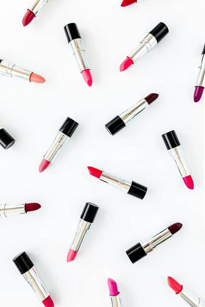 Set of color lipsticks on white background. Professional decorative cosmetics, product pomade for advertising. beauty, fashion. flat lay, top view - 写真・画像