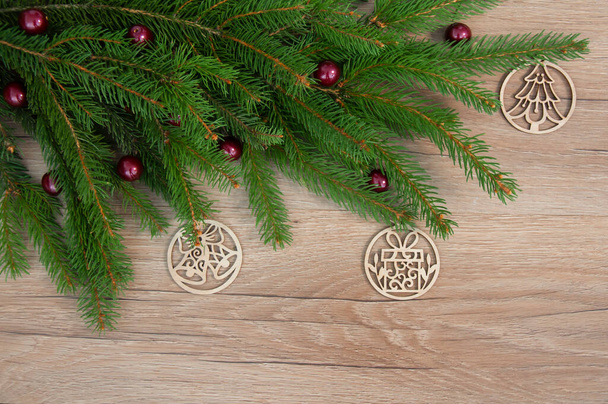 Christmas decorations on a wooden background. Winter holiday theme. Happy New Year. Space for text. - Photo, Image