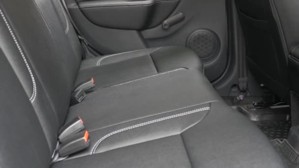 beautiful leather car interior design. Black leather seat covers in the car. artificial leather rear seats in the car. luxury leather seats in car. Slow motion - Footage, Video