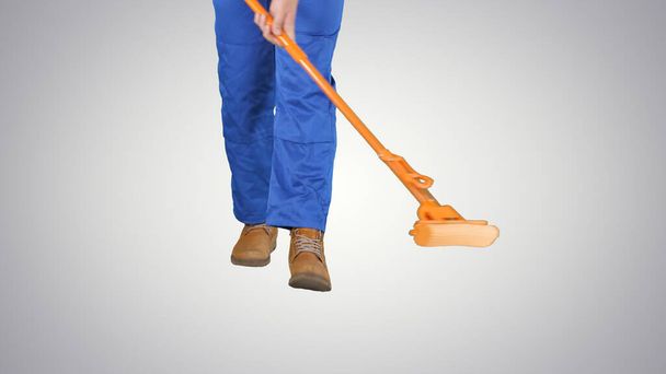 Cleaning Floor With Mop on gradient background. - Foto, imagen