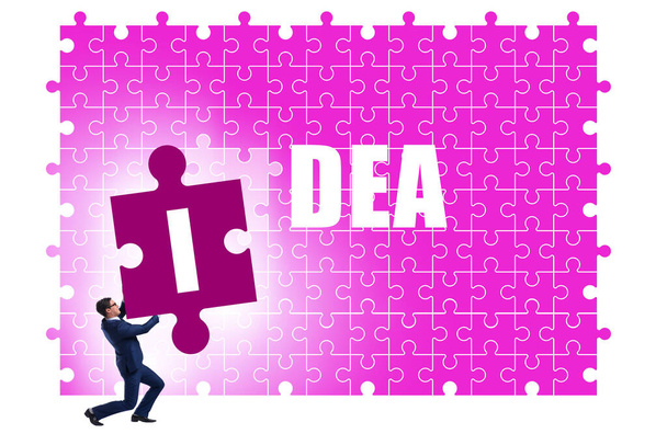 Idea concept with businessman putting jigsaw puzzle - Photo, Image