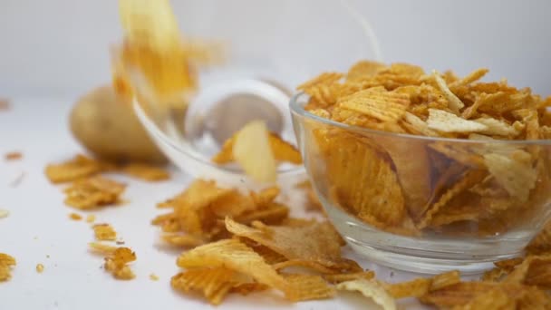 Potato Chips Rotating glass Bowl of potato chips turning slowly - Footage, Video