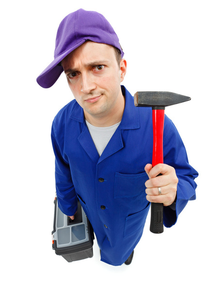 Awkward repairman with hammer - Valokuva, kuva