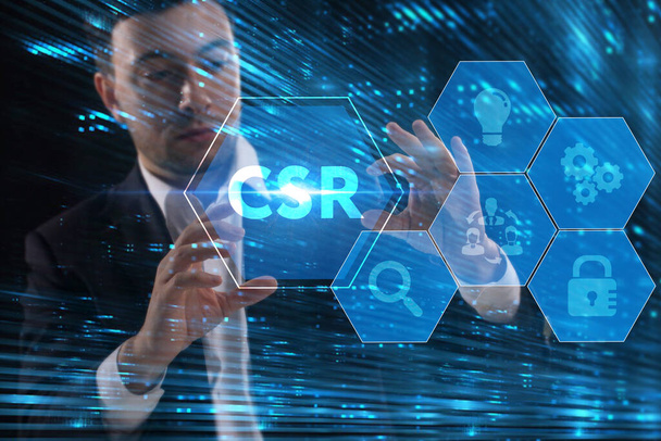 Business, Technology, Internet and network concept. Young businessman working on a virtual screen of the future and sees the inscription: CSR - Фото, зображення