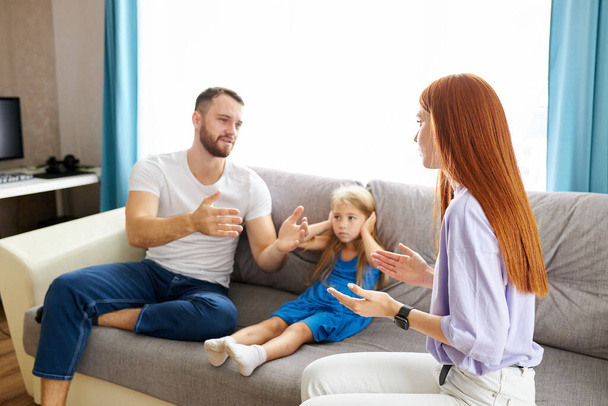 young caucasian parents argue at home - Фото, изображение