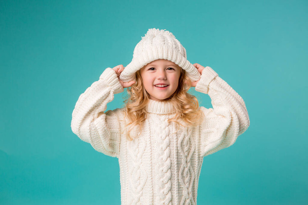 little girl in white sweater  - Фото, зображення