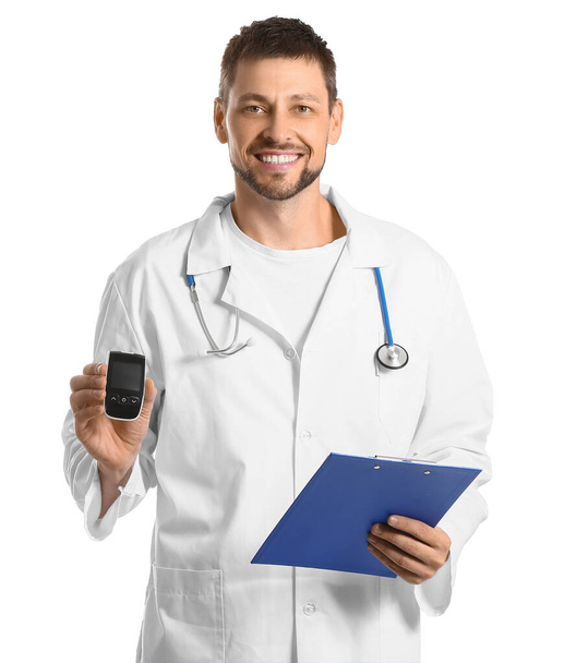 Doctor with digital glucometer on white background. Diabetes concept - Fotografie, Obrázek