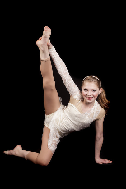 young girl dance holding leg up - Zdjęcie, obraz