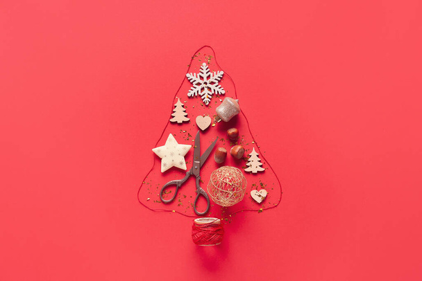 Christmas tree made of New Year decor on color background - Foto, immagini
