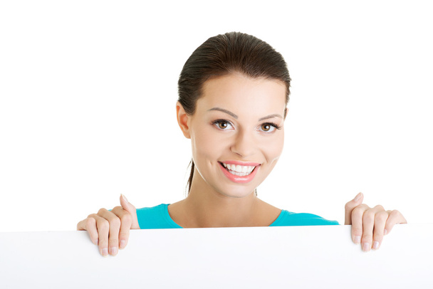Portrait young happy woman with blank board - Photo, Image