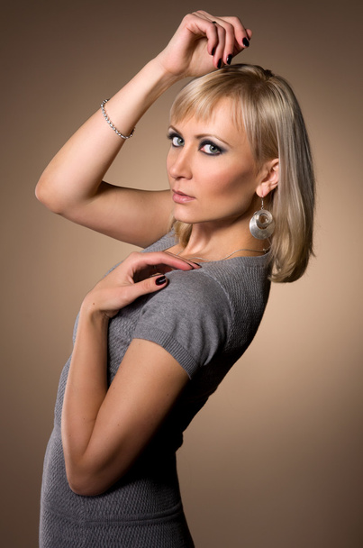 blond woman in a slinky dress - Foto, afbeelding
