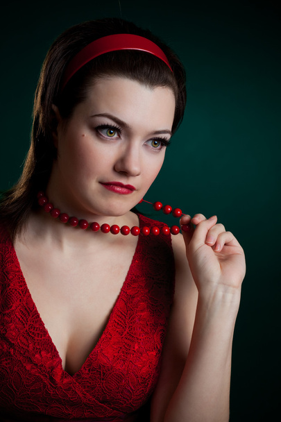 Woman touching beads - Foto, afbeelding