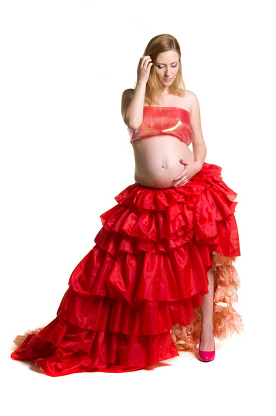 Fashionable beautiful pregnant in luxurious skirt - Fotó, kép