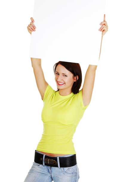 Woman showing signboard - 写真・画像