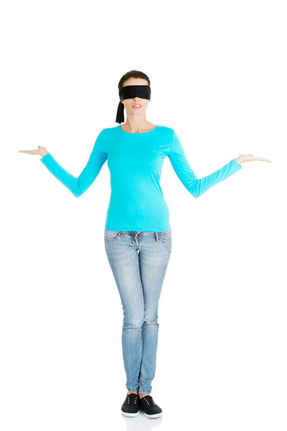 Blindfold woman presenting copy space - Фото, изображение