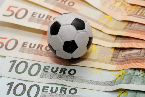 Football and Euro money. Online bet - sports betting and gambling addiction - sport and soccer - Photo, Image
