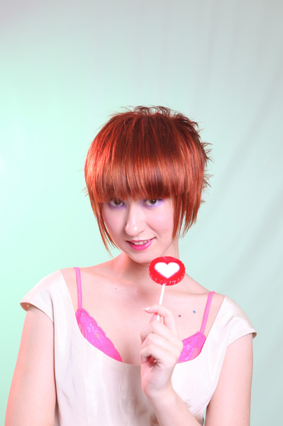 Portrait young girl  with lollipop - Fotó, kép