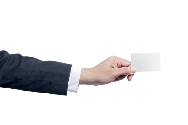Businessman showing an empty card with his hand isolated over white background - 写真・画像