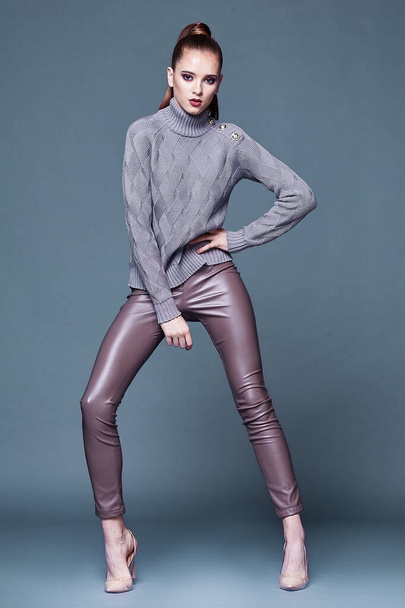 Beautiful sexy pretty woman perfect body shape face makeup wear lilac wool cashmere sweater and skinny lather pants shoes accessory casual clothes for party walk brunette hair fashion style. - Φωτογραφία, εικόνα