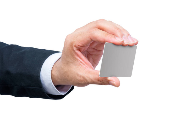 Empresario mostrando una tarjeta vacía con su mano aislada sobre fondo blanco - Foto, Imagen