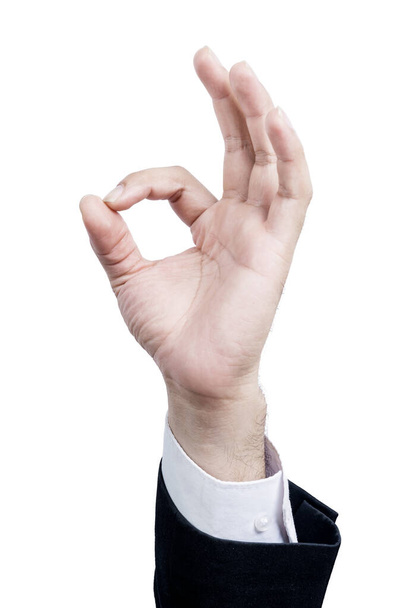 Businessman showing an ok sign with his hand isolated over white background - Фото, зображення