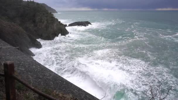 devastating and spectacular sea storm in Framura, Liguria Cinque Terre - sea waves crash on the rocks of the coast creating an explosion of water - Footage, Video