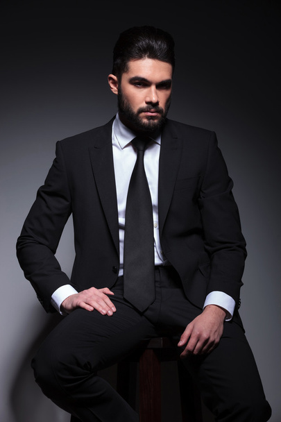young fashion business man sits on chair - 写真・画像