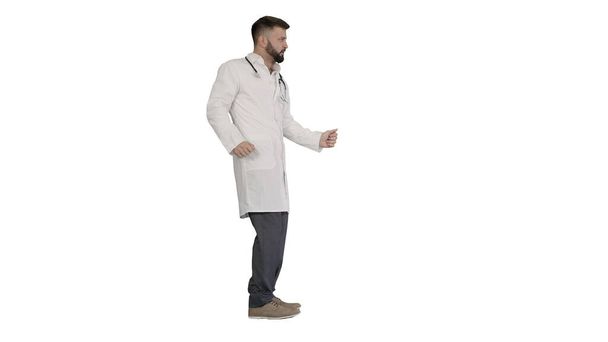 Arab doctor dancing and having fun on white background. - Foto, afbeelding