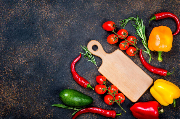 Fresh vegetables, spices, herbs. Ingredients for healthy cooking or salad making on dark rustic background with space for your text. Top view. - Foto, Imagen