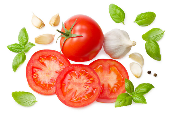fresh tomato slices with garlic and basil leaves isolated on white background. top view - Foto, Imagen