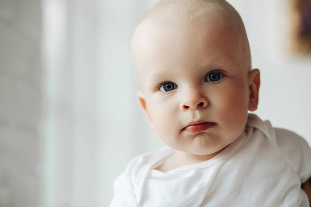 Shot of an adorable little infant indoors - Photo, Image