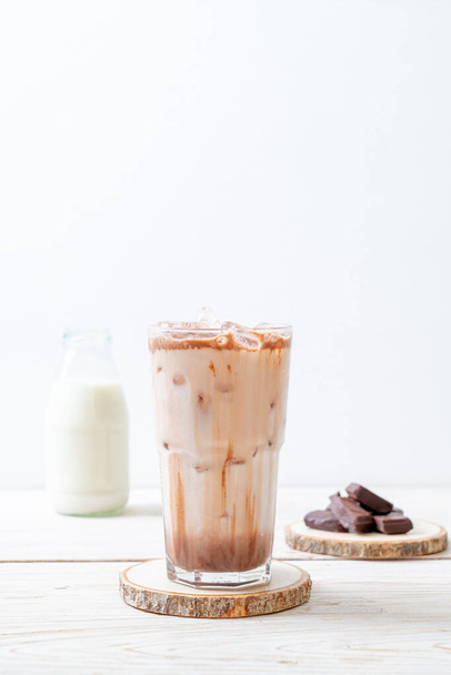 Iced chocolate milkshake drink on wood background - Zdjęcie, obraz