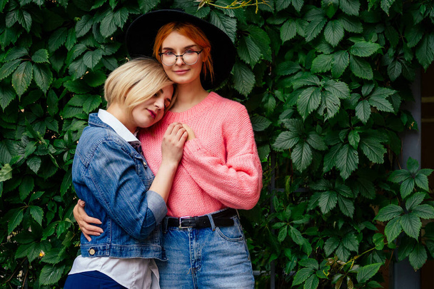 two cheerful same sex people in love walking outdoors in Europe - Fotografie, Obrázek