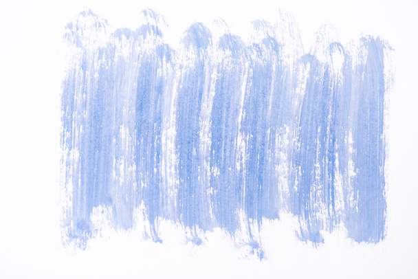 top view of abstract blue paint brushstrokes on white background - Foto, Imagem