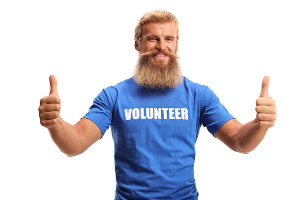 Young male volunteer showing thumbs up isolated on white background - Φωτογραφία, εικόνα