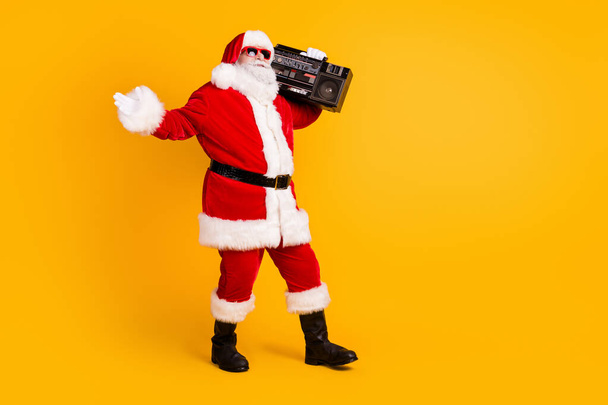 Full length body size view of his he nice funny funky thick white-haired Santa dj mc deejay carrying boombox dancing rest isolated bright vivid shine vibrant yellow color background - Fotoğraf, Görsel