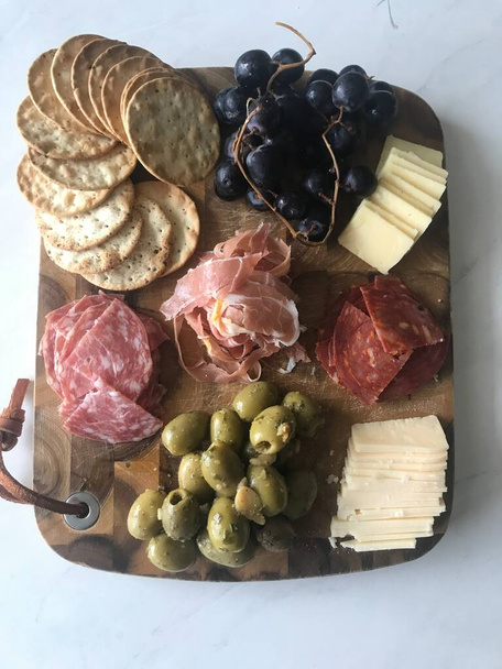Simple, fancy Charcuterie board with meats and cheeses - Photo, Image