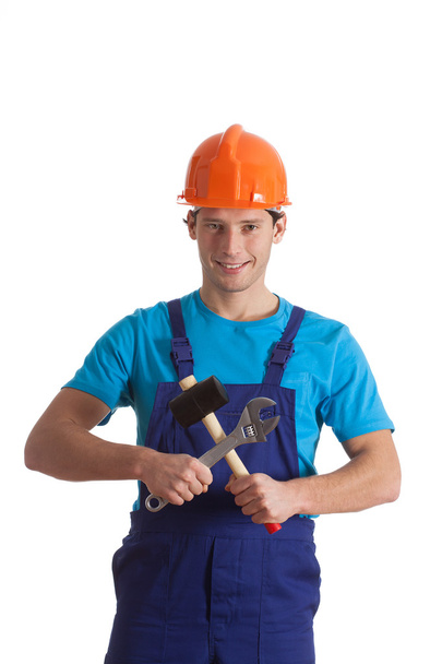 Builder with hammer and wrench - Valokuva, kuva