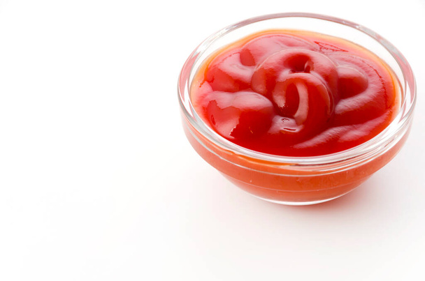 tomato ketchup in a small glass bowl on a white background - Photo, Image