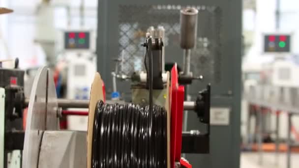 Industrial production - production of black rubber gaskets - winding on a roll - Footage, Video