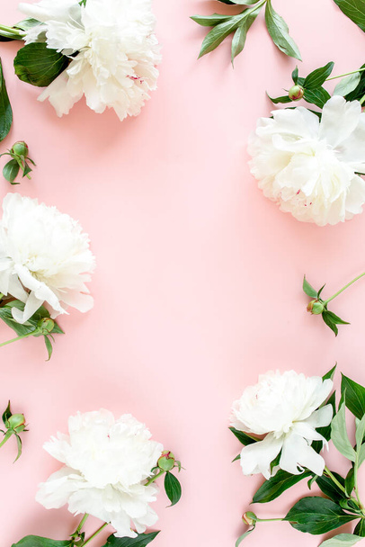 Frame of white peony flowers with space for text on pink background. Peony texture. Flat lay, top view.  - Photo, Image